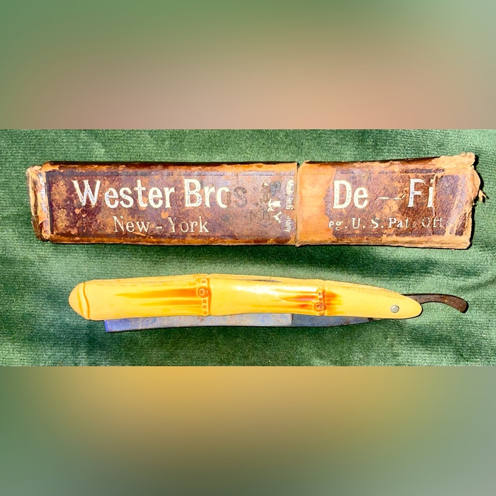 Antique Western Bros New York Bone handle straight razor with box.
